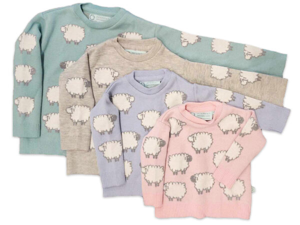 Flatlay of four kids' merino wool sheep jumpers stacked in pastel green, light smoke grey, pastel blue, and pastel pink.