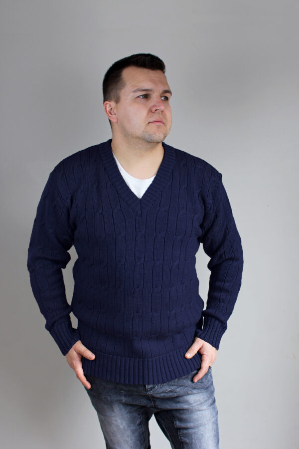Man wearing Connor Chunky Cable Knitted V-Neck Jumper in Princeton navy, gazing out the window