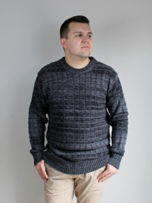 A man wearing Stormy Grey, Michael Bricks designed jumper, showcasing the intricate knit detail and grey marl colours.